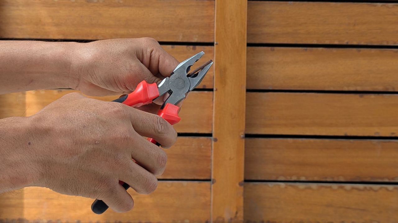 Power tools, hand tools and safety equipment on a workshop bench